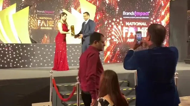 Manish Goel receiving the National Fame Award on stage